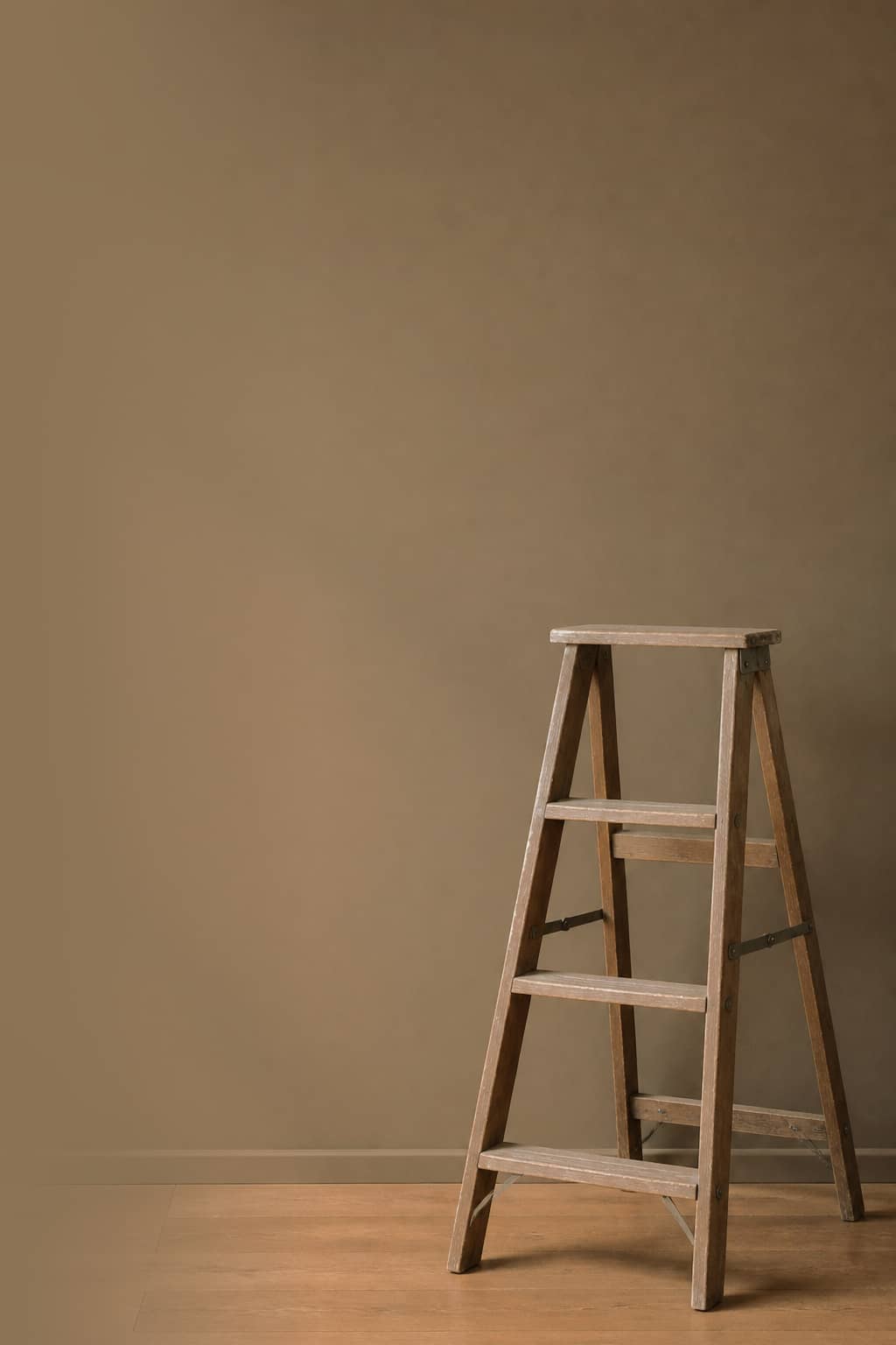 Stepladder against a clay painted wall